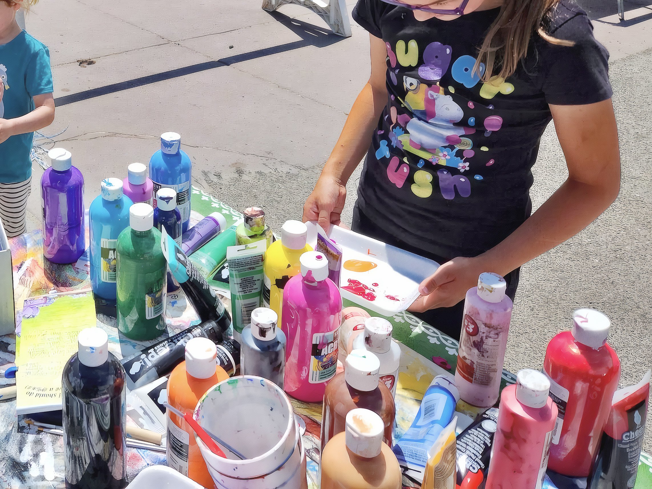 Children painting at art table