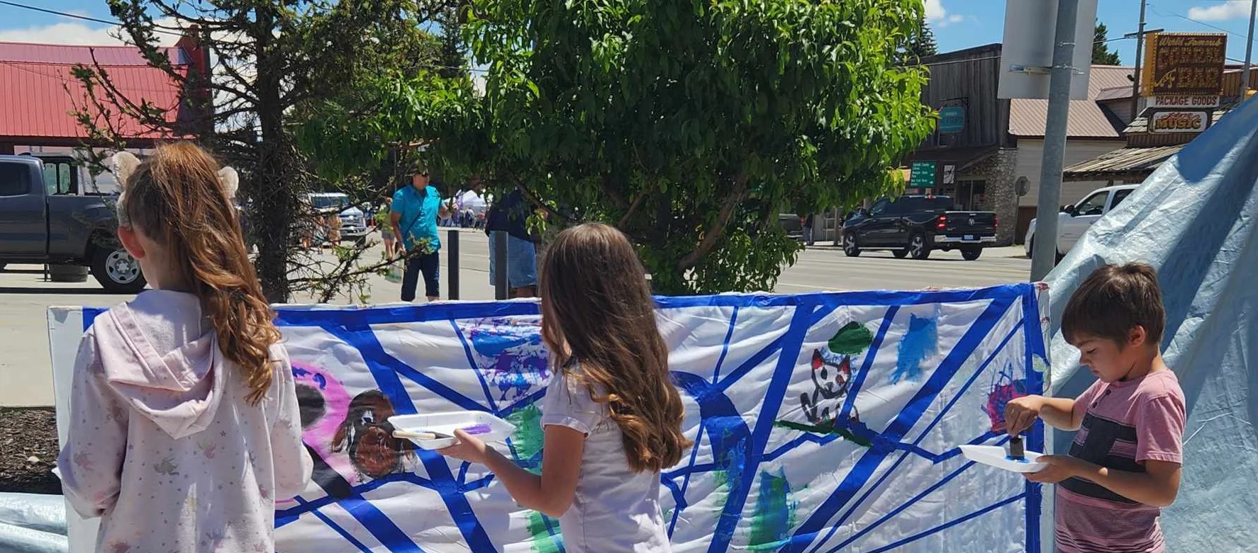 Children painting at a community event